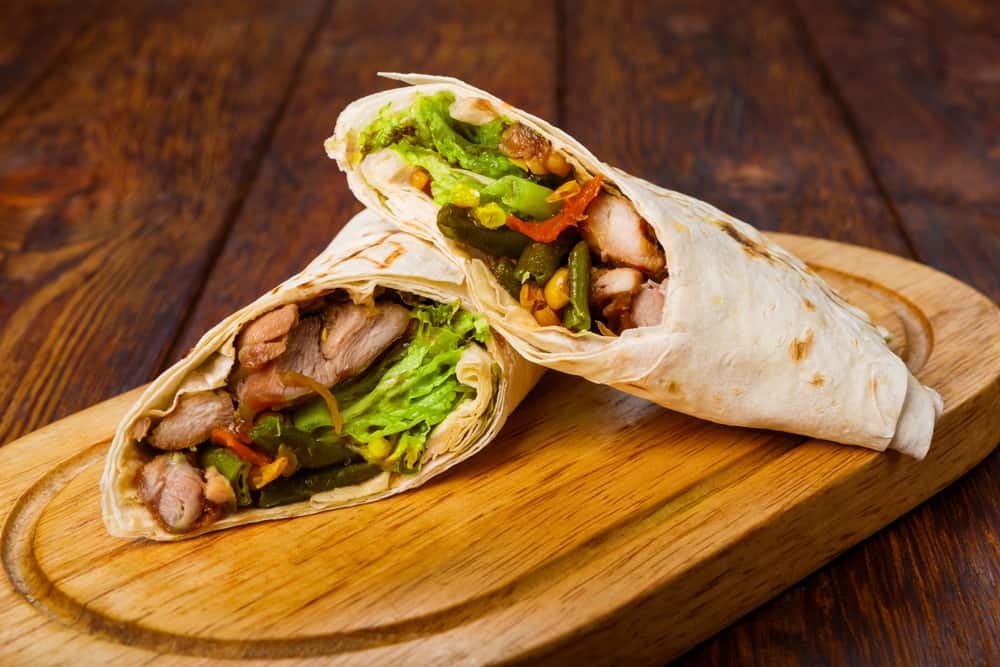 Mexican restaurant fast food - wrapped burritos with chicken and vegetables